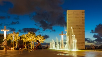 Feature lighting elegantly illuminates the fountain and the dancing water jets at night.